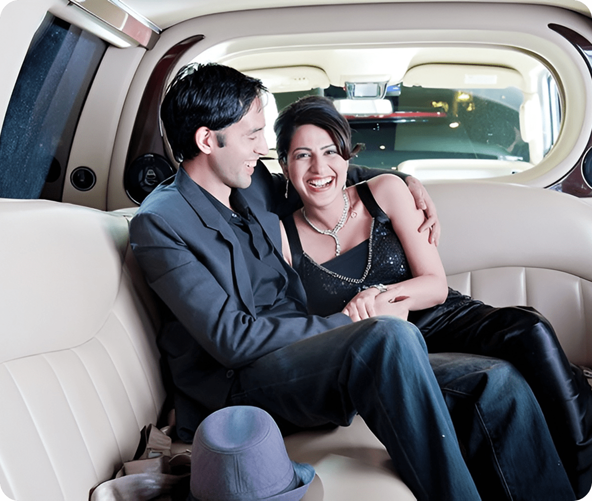 Smiling duo inside a luxury car