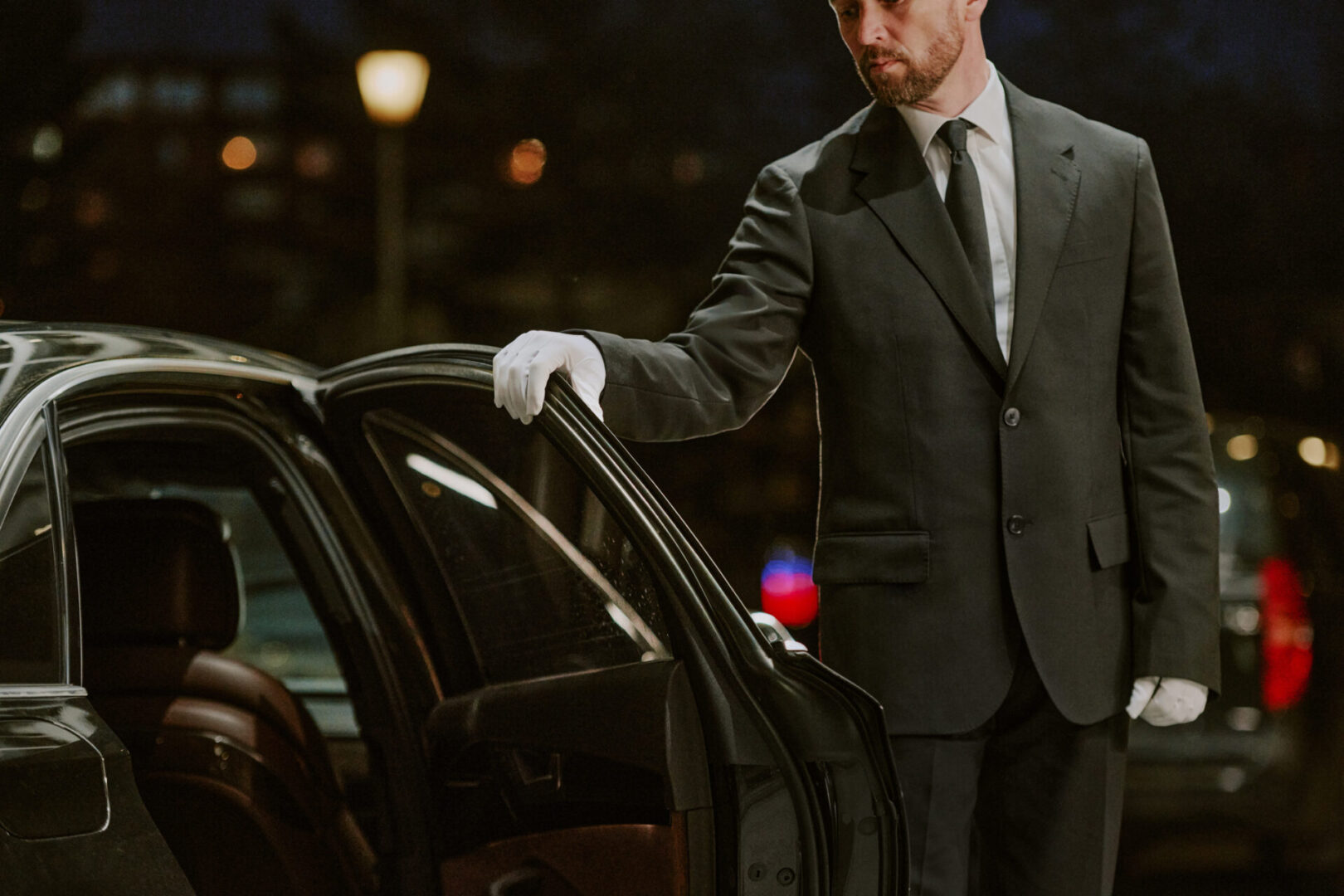 Professional chauffeur service in evening setting